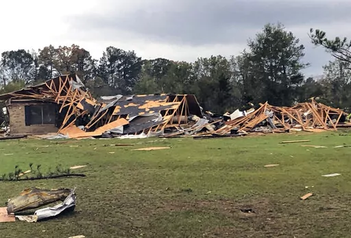 Scenes of devastation are visible in all directions along Lamar County Road 35940, west of State Highway 271, after a massive tornado hit the area, causing extensive damage and destroying an unknown number of homes, Friday, Nov. 4, 2022 in Powderly, Texas. (Jeff Forward/The Paris News via AP)