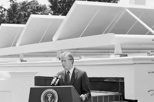 President Jimmy Carter speaks against a backdrop of solar panels at the White House, June 21, 1979, in Washington. (AP Photo/Harvey Georges, File)
