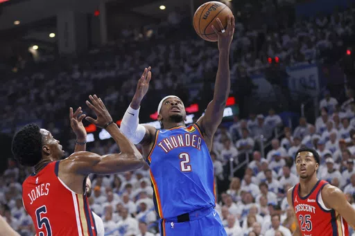 Oklahoma City Thunder guard Shai Gilgeous-Alexander (2) shoots next to New Orleans Pelicans forward Herbert Jones (5) as Pelicans guard Trey Murphy III (25) watches during the first half in Game 2 of an NBA basketball first-round playoff series Wednesday, April 24, 2024, in Oklahoma City. (AP Photo/Nate Billings)