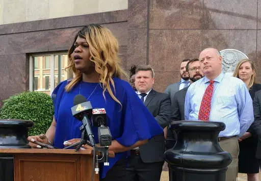 Lead plaintiff Kayla Gore speaks at a news conference outside the federal courthouse in Nashville, Tenn., April 23, 2019. A federal appeals court panel ruled 2-1 on Friday, July 12, 2024, that Tennessee does not unconstitutionally discriminate against transgender people by not allowing them to change the sex designation on their birth certificates. (AP Photo/Travis Loller, File)