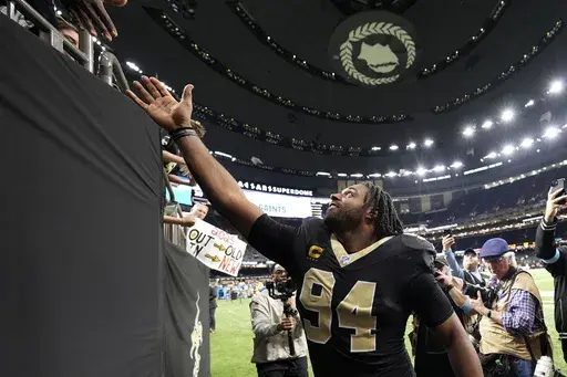 New Orleans Saints defensive end Cameron Jordan (94) reacts with fans after an NFL football game against the Las Vegas Raiders, Sunday, Dec. 29, 2024, in New Orleans. (AP Photo/Gerald Herbert)