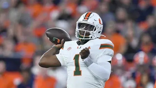 Miami quarterback Cam Ward throws during the first half of an NCAA college football game against Syracuse on, Nov. 30, 2024 in Syracuse, N.Y. (AP Photo/Adrian Kraus, File)