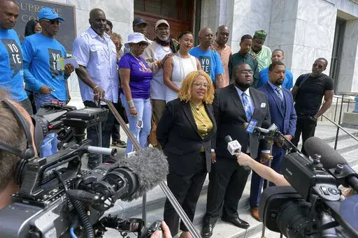Attorneys and backers of an effort to make a ban on non-unanimous jury verdicts retroactive in New Orleans gather on the steps of the state Supreme Court building, Tuesday, May 10, 2022, after the court heard arguments.  Prohibitions against non-unanimous jury convictions — outlawed by Louisiana voters in 2018 and, later, by the U.S. Supreme Court — do not have to apply retroactively to earlier convictions, Louisiana's highest court ruled Friday, Oct. 21, 2022. (AP Photo/Kevin McGill, File)