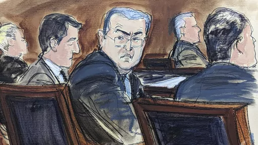 In this courtroom sketch from federal court in New York, Tuesday, Feb. 20, 2024, former Honduran President Juan Orlando Hernández, seated center at the defense table, turns to looks at prospective jurors during the jury selection process at the start of his trial. Hernández took the witness stand in his defense at his New York trial on Tuesday, March 5, denying that he teamed up with drug dealers to protect them in return for millions of dollars in bribes. (Elizabeth Williams via AP, File)