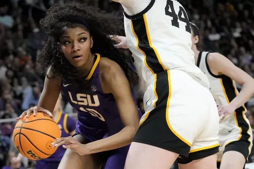 LSU forward Angel Reese (10) drives around Iowa forward Addison O'Grady (44) during the fourth quarter of an Elite Eight round college basketball game during the NCAA Tournament, Monday, April 1, 2024, in Albany, N.Y. (AP Photo/Mary Altaffer)