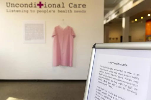 A content disclaimer sits at the entrance to the Unconditional Care exhibit Monday, March 6, 2023, at the Lewis-Clark State College Center for Arts & History in Lewiston, Idaho. Artists said some of their works weren't allowed in the exhibit by LCSC, which cited Idaho's No Public Funds for Abortion for removing some of the pieces. In Idaho, an art exhibit was censored and teens were told they couldn't testify in some legislative hearings. In Washington, a lawmaker proposed a hotline for reportin