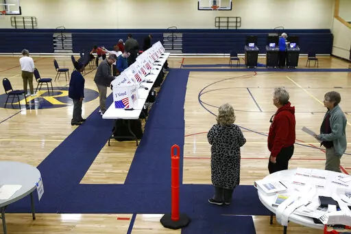 Voters fill out their ballots at a primary polling place, Feb. 29, 2020, in North Charleston, S.C. Democrats elevated South Carolina to the top of their presidential primary calendar, leapfrogging Iowa and New Hampshire. Republicans, meanwhile, could potentially have two homegrown South Carolina presidential candidates in the race, a prospect that has already caused friction among the state’s GOP circles of supporters. (AP Photo/Patrick Semansky, File)