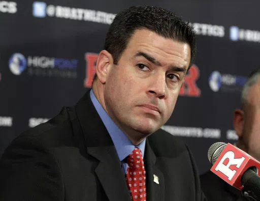 In this Jan. 31, 2012 file photo, Rutgers Athletic Director Tim Pernetti listens to a question during a news conference in Piscataway, N.J. The American Athletic Conference has hired former Rutgers athletic director Tim Pernetti as its next commissioner to replace the retiring Mike Aresco. (AP Photo/Mel Evans, File)