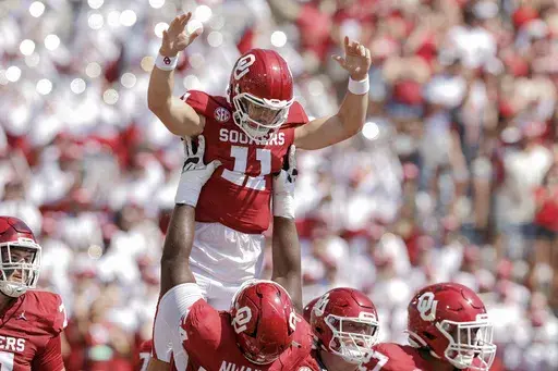 Oklahoma quarterback Jackson Arnold (11) celebrates after scoring a touchdown against Tulane during the first quarter of an NCAA college football game, Saturday, Sept. 14, 2024, in Norman, Okla. (AP Photo/Alonzo Adams)