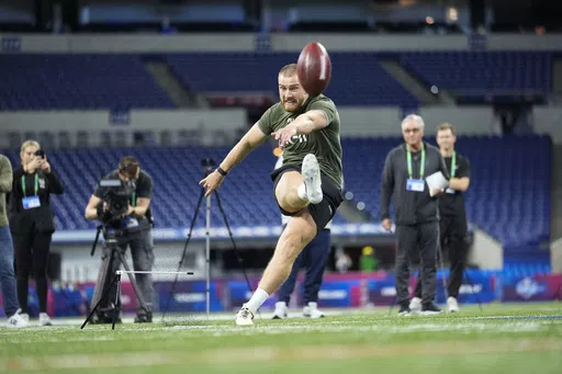 Kicker Mark Jackson of Ireland runs a drill at the NFL football scouting combine, Sunday, March 3, 2024, in Indianapolis. Ireland has become part of the NFL’s international playbook as Irish interest in the sport increases. Dublin is under review to potentially join the league’s growing list of international cities hosting a regular-season game. (AP Photo/Michael Conroy, File)