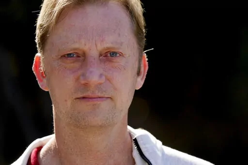 U.S. Navy veteran Michael White stands for a portrait Jan. 13, 2021, in San Diego. White, who was jailed in Iran for nearly two years, sued the Iranian government on Thursday, March 17, 2022, for $1 billion, alleging that he was kidnapped, held hostage and tortured. (AP Photo/Gregory Bull, File)