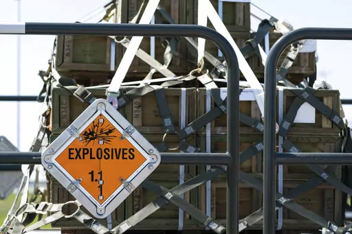Fuses for 155 mm shells ultimately bound for Ukraine are prepared to be loaded on a C-17 flight, April 29, 2022, at Dover Air Force Base, Del. As the war rages on in Ukraine, the United States is doing more than supporting an ally. It's learning lessons — with an eye toward a possible clash with China. (AP Photo/Alex Brandon, File)