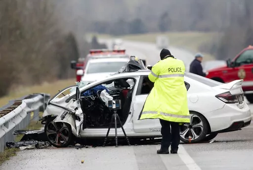 Emergency crews work the scene of a fatal crash involving a charter bus and car on the AA highway in Campbell County, Ky., Jan. 25, 2020. Roadway deaths rose 7% during the first three months of 2022 to 9,560 people, the highest number for a first quarter in two decades, according to estimates by the National Highway Traffic Safety Administration. (Albert Cesare/The Cincinnati Enquirer via AP, File)