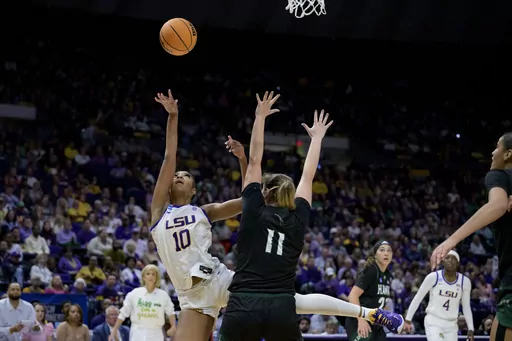 LSU forward Angel Reese (10) shoots against Hawaii forward Kallin Spiller (11) during the second half of a first-round college basketball game in the women's NCAA Tournament in Baton Rouge, La., Friday, March 17, 2023. (AP Photo/Matthew Hinton)
