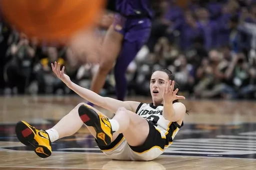 FILE -Iowa's Caitlin Clark looks for a call during the second half of the NCAA Women's Final Four championship basketball game against LSU Sunday, April 2, 2023, in Dallas. The national championship game in women's basketball last spring was unforgettable for a lot of good reasons.The game will also be remembered for its controversial officiating and The Associated Press has learned that an NCAA review concluded the refereeing did not meet expectations. (AP Photo/Tony Gutierrez, File)