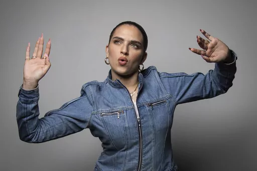 Mae Muller, representing the United Kingdom in the Eurovision Song Contest poses for a photographer, in London Tuesday, March 14, 2023. (Photo by Vianney Le Caer/Invision/AP)