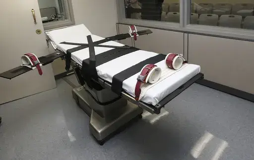 This Oct. 9, 2014, file photo shows the gurney in the the execution chamber at the Oklahoma State Penitentiary in McAlester, Okla. (AP Photo/Sue Ogrocki, File)