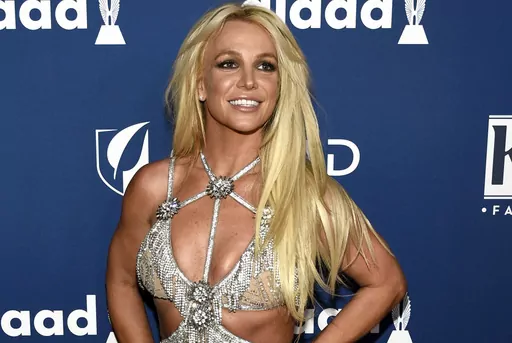 In this April 12, 2018 file photo, Britney Spears arrives at the 29th annual GLAAD Media Awards in Beverly Hills, Calif. Spears is shooting down rumors of a new album, vowing to “never return to the music industry.” At the same time, Spears noted in an Instagram post Wednesday, Jan. 3, 2024, she's still writing music — just for other people. (Photo by Chris Pizzello/Invision/AP, File)