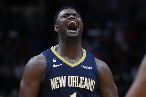 New Orleans Pelicans forward Zion Williamson (1) reacts after being fouled on a 3-point play in the second half of an NBA basketball game against the Minnesota Timberwolves in New Orleans, Wednesday, Dec. 28, 2022. Williamson scored a career high 43 points and the Pelicans won 119-118. (AP Photo/Gerald Herbert)