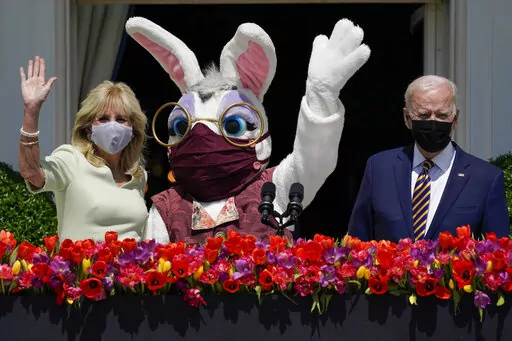 President Joe Biden appears with first lady Jill Biden and the Easter Bunny on the Blue Room balcony at the White House April 5, 2021, in Washington. The White House Easter Egg Roll is returning on April 18, 2022, after a 2-year, COVID-induced hiatus. The Biden's will welcome some 30,000 kids and their adult chaperones for the egg roll, an egg hunt and other activities. (AP Photo/Evan Vucci, File)