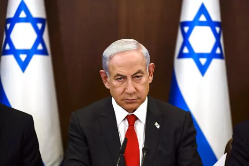 Israeli Prime Minister Benjamin Netanyahu convenes a weekly cabinet meeting at the Prime Minister's office in Jerusalem, Sunday, Jan. 8, 2023. (Ronen Zvulun/Pool Photo via AP)