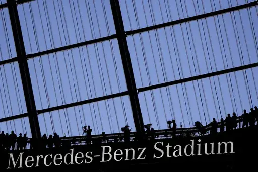 Fans watch an NFL football game at the Mercedes-Benz Stadium in Atlanta, Dec. 1, 2024. (AP Photo/Mike Stewart, File)