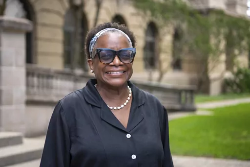 Kathleen McElroy poses Tuesday, June 13, 2023, in College Station, Texas. Texas A&M University reached a $1 million settlement Thursday, Aug. 3, 2023, with McElroy, a Black journalism professor, after botched attempts to hire her unraveled after pushback over her past work promoting diversity. (Meredith Seaver/College Station Eagle via AP, File)