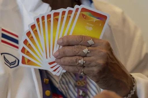 Manthanee Yaisawang from Thailand wears jewelry with the Diamond, Spade, Club and Heart symbol of playing cards as she takes part in the Bridge Women's Team Round Robin event against India for the 19th Asian Games in Hangzhou, China, Wednesday, Sept. 27, 2023. The 500-year-old card game of bridge is another type of "esport" at the Asian Games. With an apology to the demographic, here the "e" stands for elderly, not electronic, as in the youth-driven, video-game competition that's soaring in popu