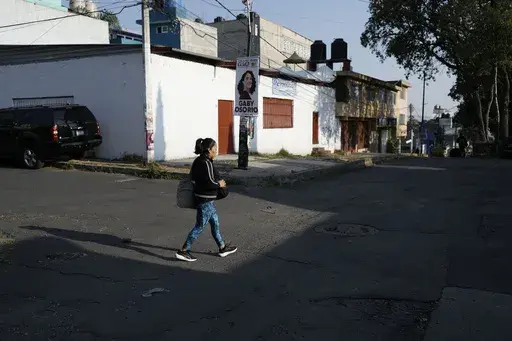Domestic worker Concepcion Alejo heads to her workplace, in Mexico City, Wednesday, April 24, 2024. Alejo is among approximately 2.5 million Mexicans — largely women — who serve as domestic workers in the Latin American nation. (AP Photo/Marco Ugarte)