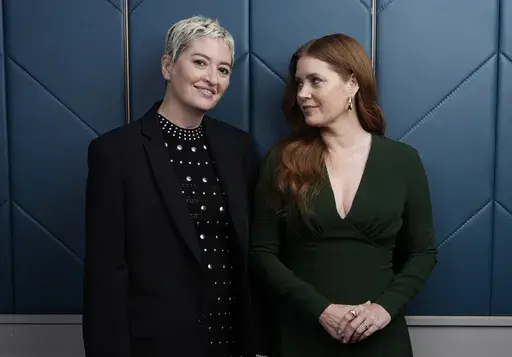 Marielle Heller, left, the writer/director of "Nightbitch," and the film's star Amy Adams pose for a portrait during the Toronto International Film Festival, Sunday, Sept. 8, 2024, in Toronto. (AP Photo/Chris Pizzello)