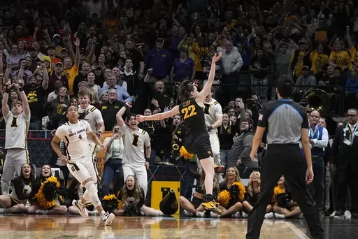 Iowa's Caitlin Clark reacts after an NCAA Women's Final Four semifinals basketball game against South CarolinaFriday, March 31, 2023, in Dallas. Iowa won 77-73 to advance to the championship on Sunday. (AP Photo/Darron Cummings)