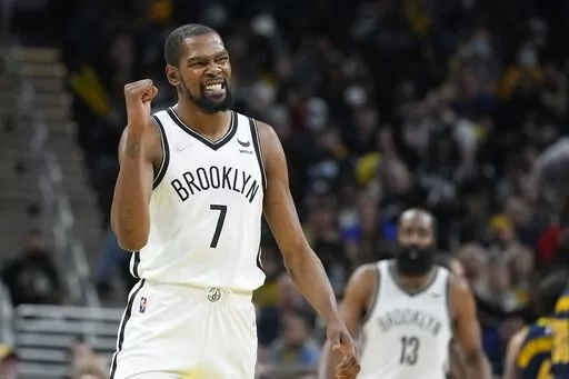 Brooklyn Nets' Kevin Durant reacts during the second half of an NBA basketball game against the Indiana Pacers, Wednesday, Jan. 5, 2022, in Indianapolis. Kevin Durant has requested a trade from the Brooklyn Nets, according to a person with direct knowledge of the seismic decision that undoubtedly will have teams scrambling to put together enormous offers for the perennial All-Star. (AP Photo/Darron Cummings, File)