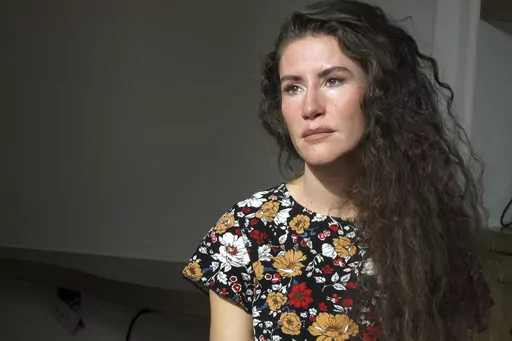 Chelsea Goodrich poses for a portrait at a friend's house in Ketchum, Idaho, on Tuesday, Sept. 19, 2023. Goodrich's father, a popular Idaho dentist and former bishop in The Church of Jesus Christ of Latter-day Saints, widely known as the Mormon church, was excommunicated after sharing details about his relationship with her when she was a child during a religious confession. Recordings obtained by The Associated Press show that instead of helping prosecutors, the church used a legal playbook tha