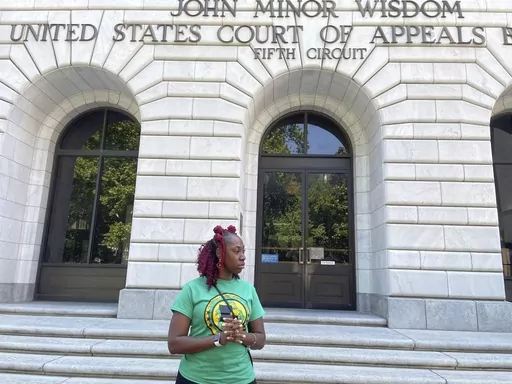 Teliah Perkins stands in front of the federal appeals court building in New Orleans, May 3, 2023, following a hearing on her lawsuit against two St. Tammany Parish, La., sheriff's deputies stemming from her arrest in May 2020. In an opinion issued Thursday, Nov. 30, a federal appeals court largely sided with the two white Louisiana sheriff's deputies in a lawsuit filed by Perkins, a Black woman, who accused them of using excessive force against her outside her home as they investigated an allega