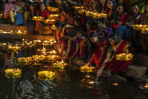 Hindu women light oil lamps at the Banganga pond as they celebrate Dev Diwali festival in Mumbai, India, Nov. 7, 2022. Diwali is the most important festival of the year in India and for Hindus in particular. It is celebrated across faiths by more than a billion people in the world’s most populous nation and the diaspora. This year, Diwali begins Friday, Nov. 10, 2023, and the festival will be observed on Sunday, Nov. 12. (AP Photo/Rafiq Maqbool, File)