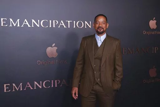 Will Smith poses for photographers upon arrival for the premiere of the film 'Emancipation' in London, Friday, Dec. 2, 2022. (Photo by Vianney Le Caer/Invision/AP)