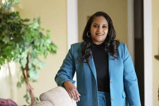 Ashley K. Shelton, executive director of Power Coalition for Equity & Justice in Louisiana, a voter advocacy organization that is trying to get left-leaning voters engaged for next year's elections, possess for a photo at her family home in Baton Rouge, La., Tuesday, Dec. 26, 2023. (AP Photo/Gerald Herbert)