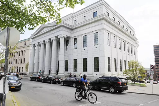 A cyclist rides past the New York Court of Appeals, May 5, 2015, in Albany, N.Y. New York’s highest court on Tuesday, Dec. 12, 2023, ordered the state to draw new congressional districts ahead of the 2024 elections, giving Democrats a potential advantage in what is expected to be a battleground for control of the U.S. House. (AP Photo/Hans Pennink, File)