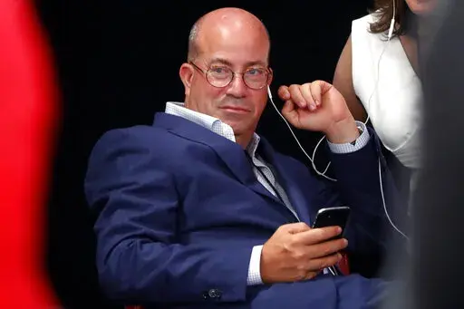 Jeff Zucker, Chairman, WarnerMedia News and Sports and President, CNN Worldwide listens in the spin room after the first of two Democratic presidential primary debates hosted by CNN on July 30, 2019, in the Fox Theatre in Detroit. CNN faces the challenge of navigating a pivotal moment in the news industry without its dominant leader, as Jeff Zucker's ouster because of a relationship with a colleague unleashed raw, angry feelings among some people he led.  (AP Photo/Paul Sancya, File)