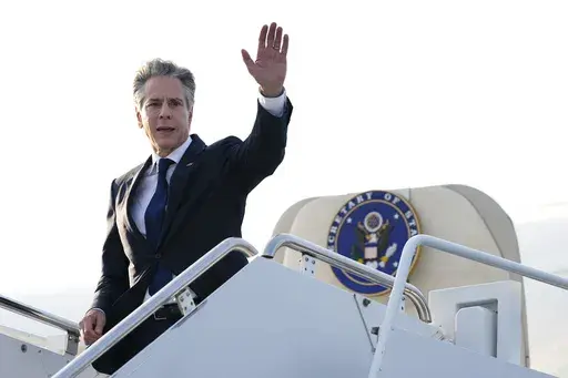 Secretary of State Antony Blinken waves as he boards his plane to depart Yokota Air Base in Fussa, on the outskirts of Tokyo, July 29, 2024. (AP Photo/Shuji Kajiyama, Pool, File)