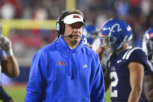 Mississippi head coach Lane Kiffin walks along the sideline during a timeout in the second half of an NCAA college football game against Vanderbilt in Oxford, Miss., Nov. 20, 2021. College football's traditional signing period, which starts Wednesday, Feb. 2, 2022, is now overshadowed by transfer moves and Kiffin has assembled one of the best groups of transferring players in the country. (AP Photo/Thomas Graning, File)