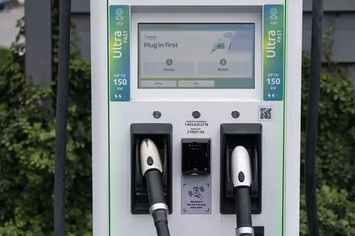 A charging station with Combined Charging System (CCS) plugs is seen in Anaheim, Calif., Friday, June 9, 2023. Owners of General Motors and Ford electric vehicles will be able charge at many of Tesla's large network of stations across the U.S. starting next year. (AP Photo/Jae C. Hong)