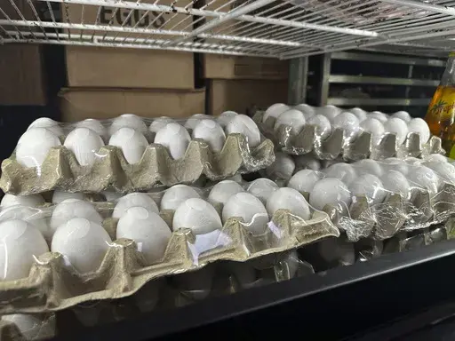 Cartons of eggs sit inside cooler at Norma's Sweets Bakery Tuesday, Feb. 11, 2025, in New Orleans. (AP Photo/Stephen Smith)