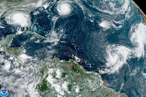 This satellite image provided by the NOAA shows five tropical storms churning in the Atlantic basin on Monday, Sept. 14, 2020. The storms, from left, are Hurricane Sally over the Gulf of Mexico, Hurricane Paulette over Bermuda, the remnants of Tropical Storm Rene, and Tropical Storms Teddy and Vicky. A NOAA study released on Wednesday, May 11, 2022 says cleaner air in Europe and the United States is helping trigger a dramatic increase in the number of Atlantic hurricanes. (NOAA via AP)