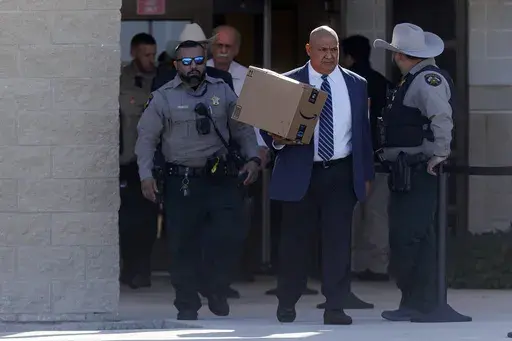 Former Uvalde school district police chief Pete Arredondo leaves the Uvalde County Justice Center, Thursday morning, Dec. 19, 2024, in Uvalde, Texas. (Sam Owens/The San Antonio Express-News via AP)