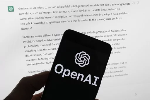 The OpenAI logo is seen on a mobile phone in front of a computer screen displaying output from ChatGPT, on March 21, 2023, in Boston. Italian regulators said they informed OpenAI that its ChatGPT artificial intelligence chatbot has violated European Union’s stringent data privacy rules. The country’s data protection authority, known as Garante, said Monday, Jan. 29, 2024, that it notified San Francisco-based OpenAI of breaches of the EU rules, known as General Data Protection Regulation. (AP