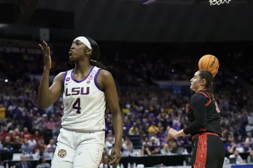 LSU guard Flau'Jae Johnson (4) blows a kiss after a steal followed by a basket against San Diego State during the first half in the first round of the NCAA college basketball tournament, Saturday, March 22, 2025, in Baton Rouge, La. (AP Photo/Matthew Hinton)