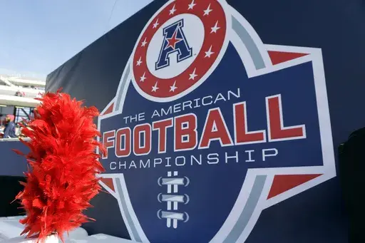 In this Dec. 5, 2015, file photo, the American Athletic Conference logo is displayed before during the championship NCAA college football game between Houston and Temple in Houston. (AP Photo/David J. Phillip, File)