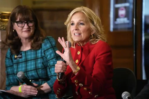 First lady Jill Biden, front, makes a point as Colorado Speaker of the House Julie McCluskie looks on during a stop to attend a roundtable discussion on the federal workforce training program to help community college students earn certificates for entry-level jobs Monday, April 3, 2023, inside the State Capitol in Denver. Both Republican and Democratic state lawmakers were on hand for the first lady's visit, the first of four stops across the country to promote the Biden Administration's effort