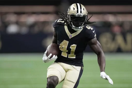 New Orleans Saints running back Alvin Kamara runs the ball during the first half of the team's preseason NFL football game against the Kansas City Chiefs in New Orleans, Aug. 13, 2023. Kamara is back this week after serving a three-game suspension in connection with his arrest in a February 2022 melee in a casino hotel in Las Vegas. (AP Photo/Gerald Herbert, File)